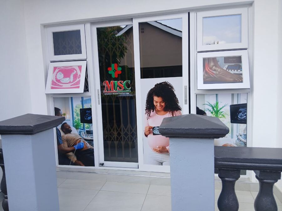 The front of Medimage Scan Centre, with the MISC logo on the glass door.